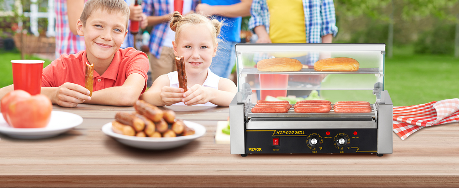 kids enjoy hot dogs at an outdoor event, featuring the VEVOR hot dog roller on a picnic table.