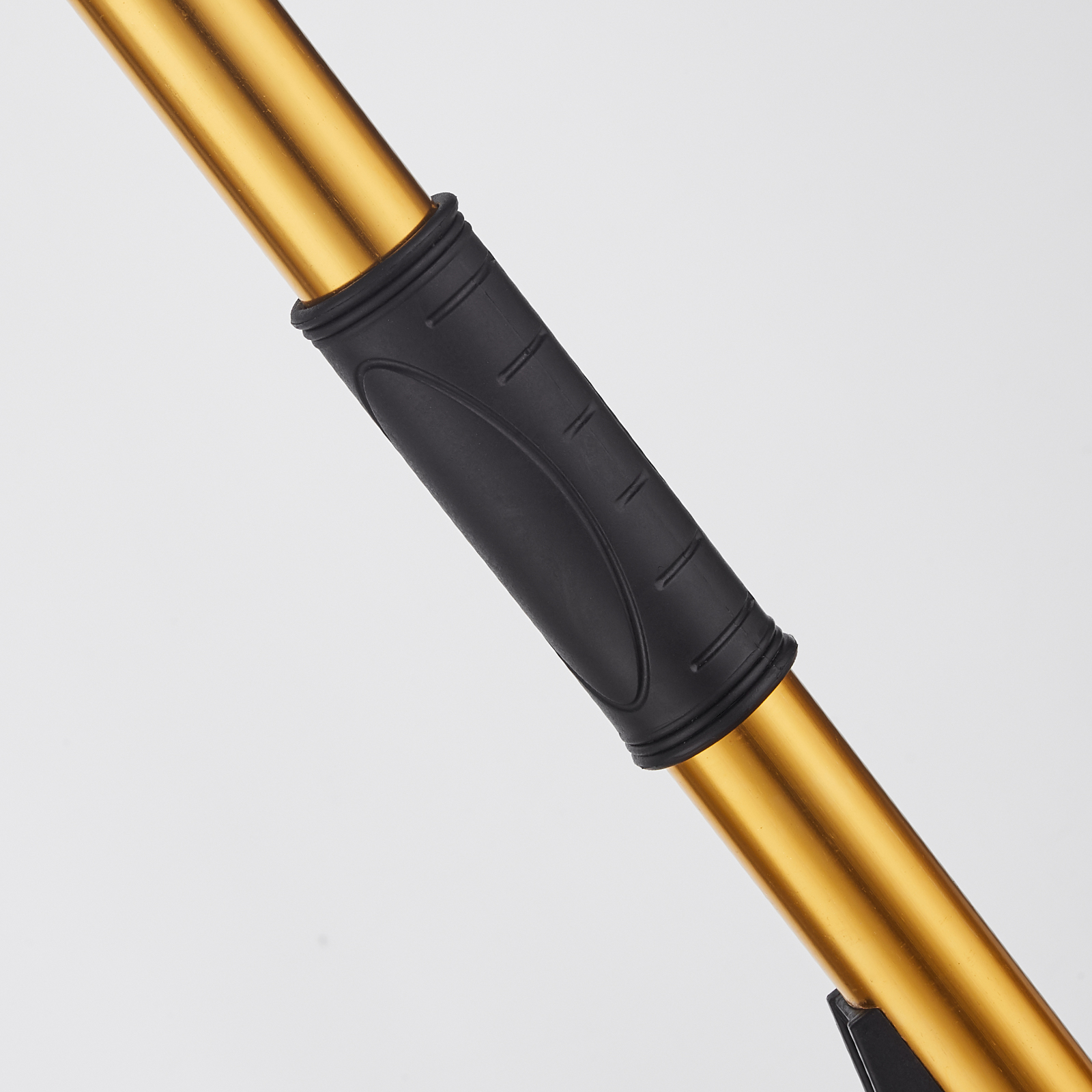 gold handlebar with black grip, part of the VEVOR drywall flat box handle, minimalistic background.