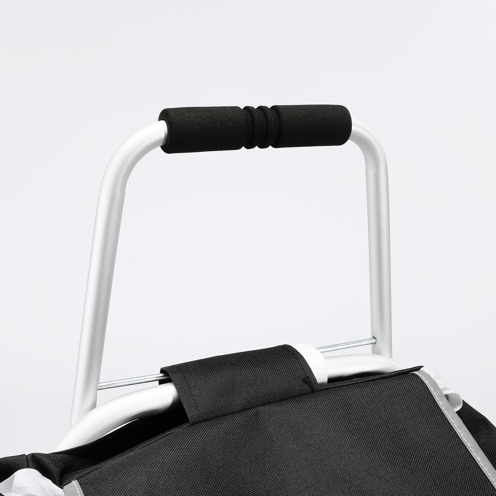 handle and support frame of a VEVOR stair climbing cart with black foam grip and black fabric bag.