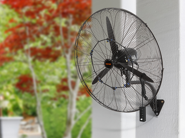 VEVOR wall-mount misting fan installed on a porch column, with lush greenery in the background.