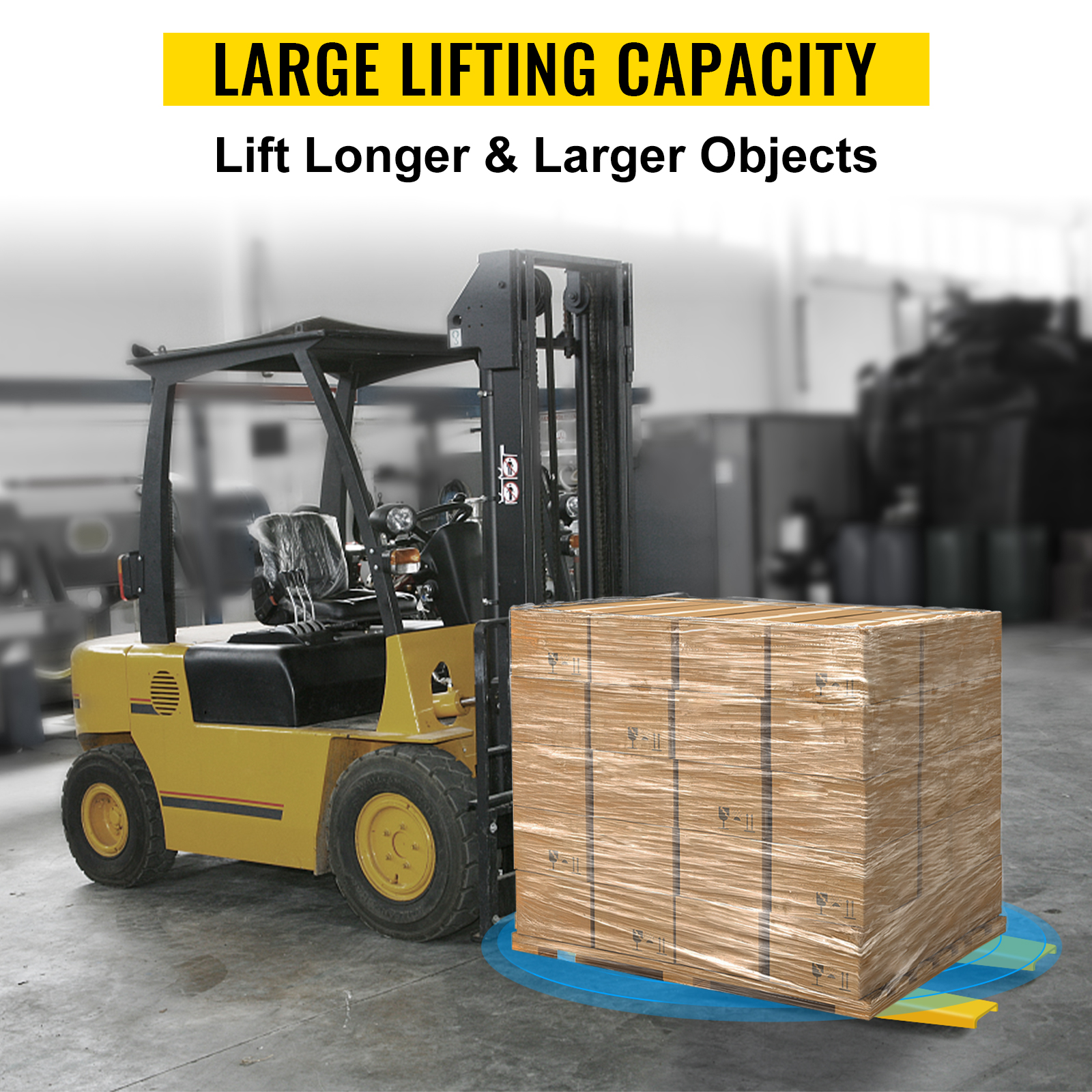 forklift lifting large wrapped pallet with VEVOR pallet fork extension in warehouse.