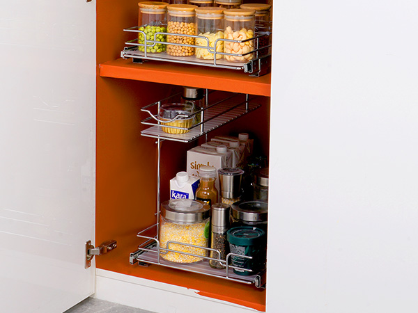 open white kitchen cabinet with VEVOR pull out cabinet organizer holding food jars and spices.