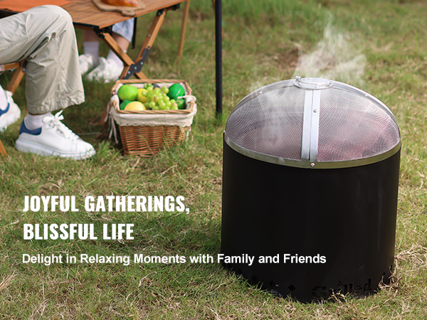 outdoor scene with VEVOR fire pit spark screen, people enjoying picnic with fruit basket on grass.