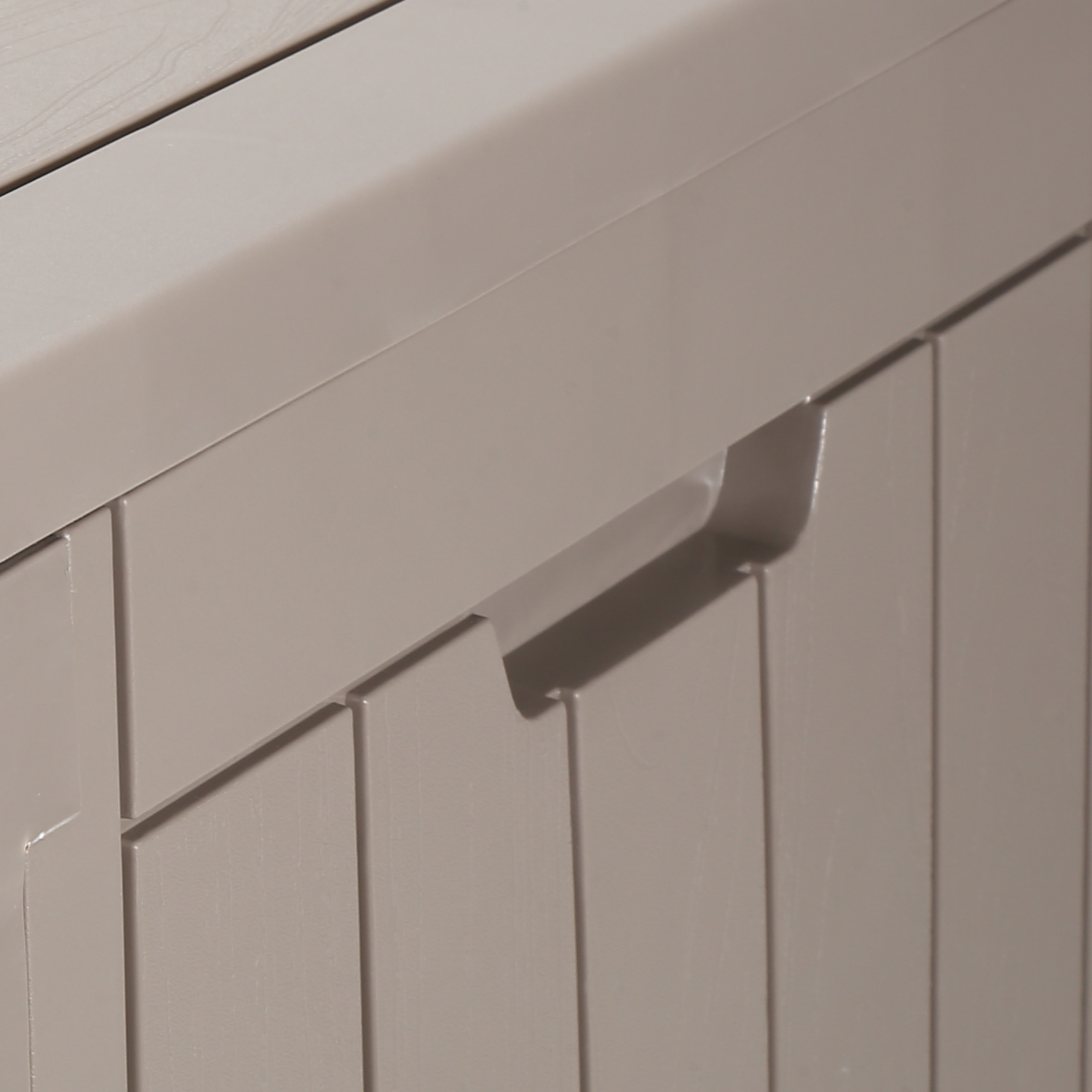 beige VEVOR deck box corner with a close-up of a handle and panel design.