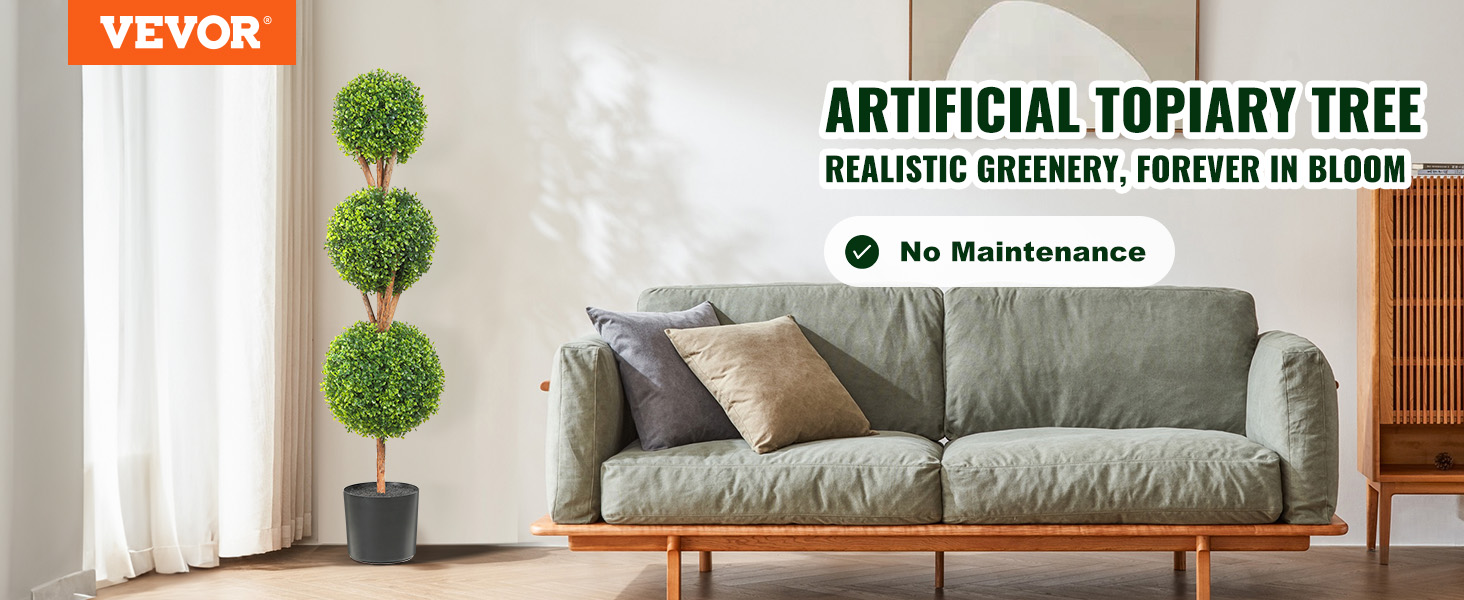 VEVOR artificial topiary tree beside green sofa with cushions in a cozy, modern living room.