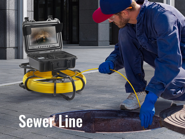 technician using VEVOR sewer camera for inspection in an urban setting with a manhole and equipment.