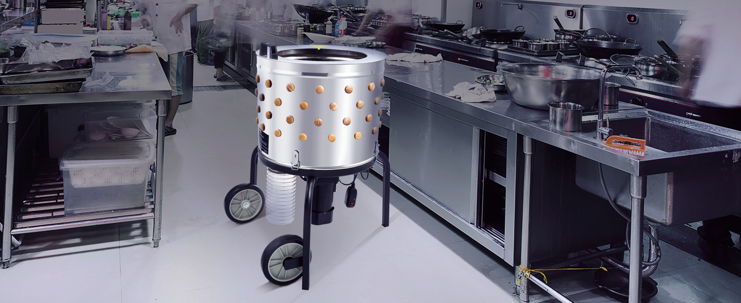 VEVOR chicken plucker in a commercial kitchen with stainless steel counters and utensils.