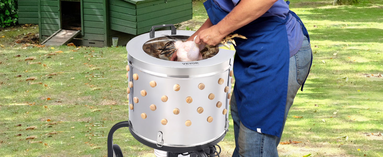 person using VEVOR chicken plucker outdoors near a green coop, stainless steel machine with rubber fingers.