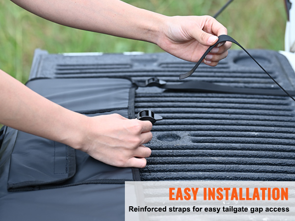 hands adjusting reinforced straps on a VEVOR tailgate pad, showcasing easy installation steps.