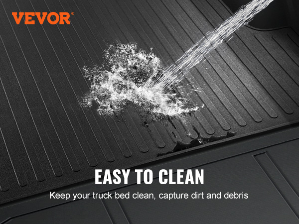 VEVOR truck bed mat being cleaned with a hose, showcasing its ease of maintenance.