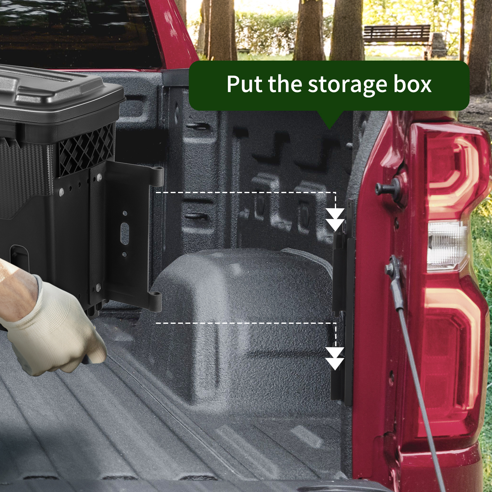 installing VEVOR truck bed storage box in a red pickup truck with a glove-clad hand.