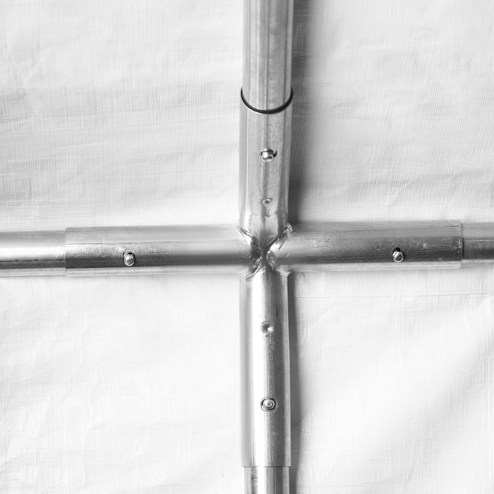 VEVOR carport metal frame joints and connections on white tarp background.