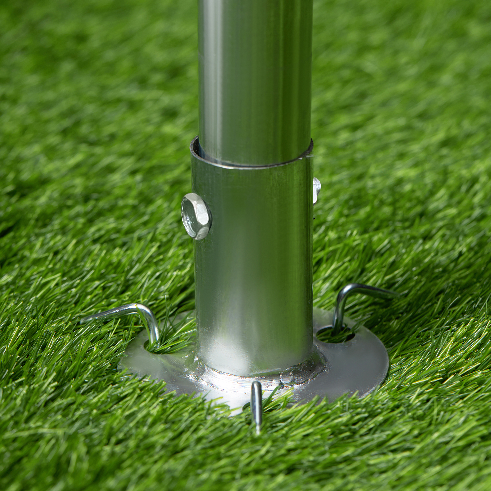 VEVOR carport steel anchor on green grass, secure pole base with ground stakes.