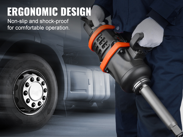 Darbinieks, kas izmanto VEVOR pneimatisko trieciena uzgriežņu atslēgu ar ergonomisku dizainu, fonā kravas automašīnas riepa.