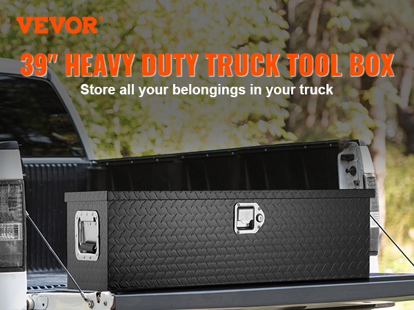 VEVOR truck bed tool box in open truck bed, heavy-duty black with diamond plate design, outdoors.