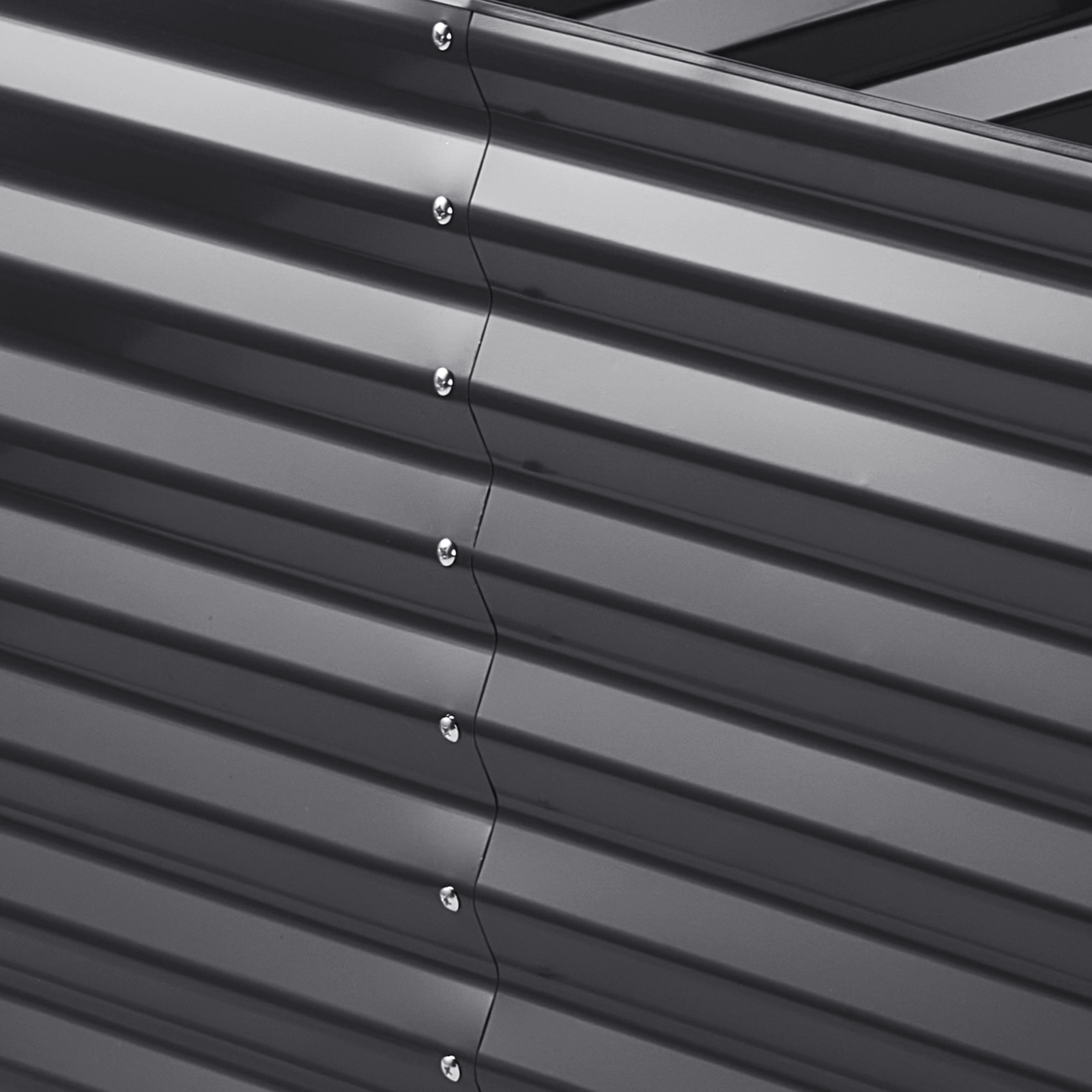 close-up of a steel VEVOR garden bed with corrugated panels and silver screws.