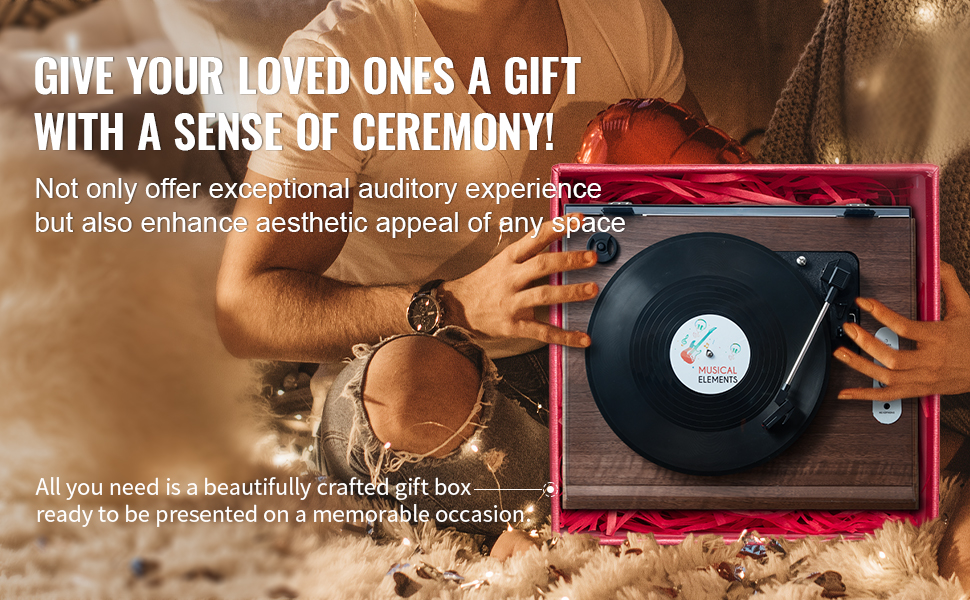 hands presenting VEVOR vinyl record player in pink gift box with festive background.