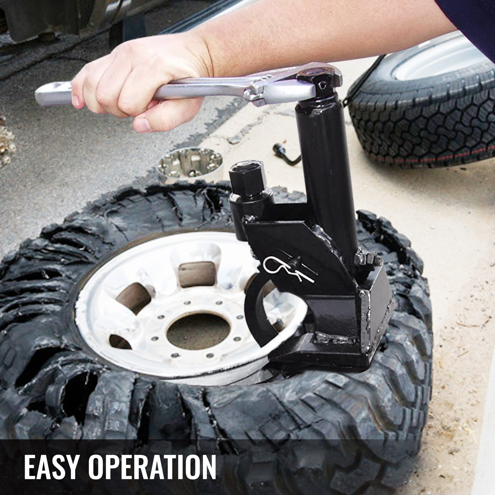 VEVOR manual tire bead breaker in use to remove tire from rim, showing easy operation.