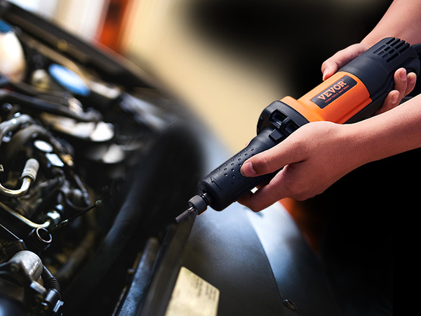 using a VEVOR die grinder near a car engine for precision work.