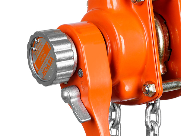 close-up of VEVOR manual lever chain hoist in orange with detailed mechanism and chains.