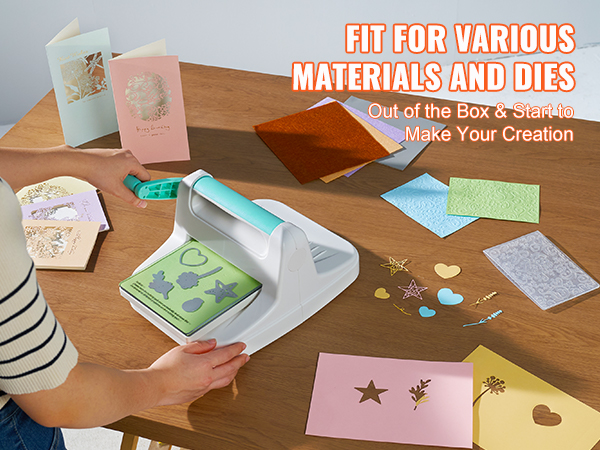 person using VEVOR die cutting machine on various materials and dies with cards on a wooden table.