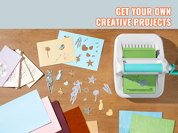 VEVOR die cutting machine with paper crafts and creative project designs on a wooden table.
