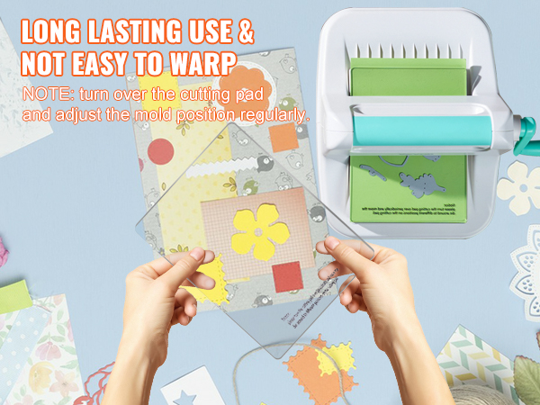 VEVOR die cutting machine, hands holding cutting pad, colorful craft paper and flowers in the background.