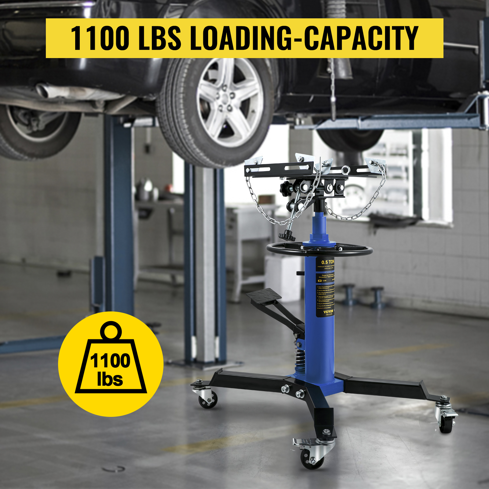 VEVOR transmission jack with 1100 lbs loading capacity in an auto repair shop.
