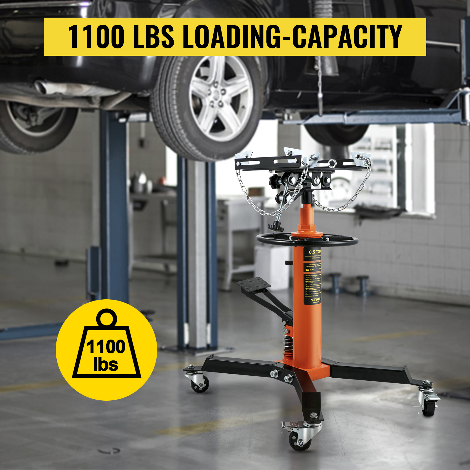 VEVOR transmission jack with 1100 lbs loading capacity in a car repair garage.