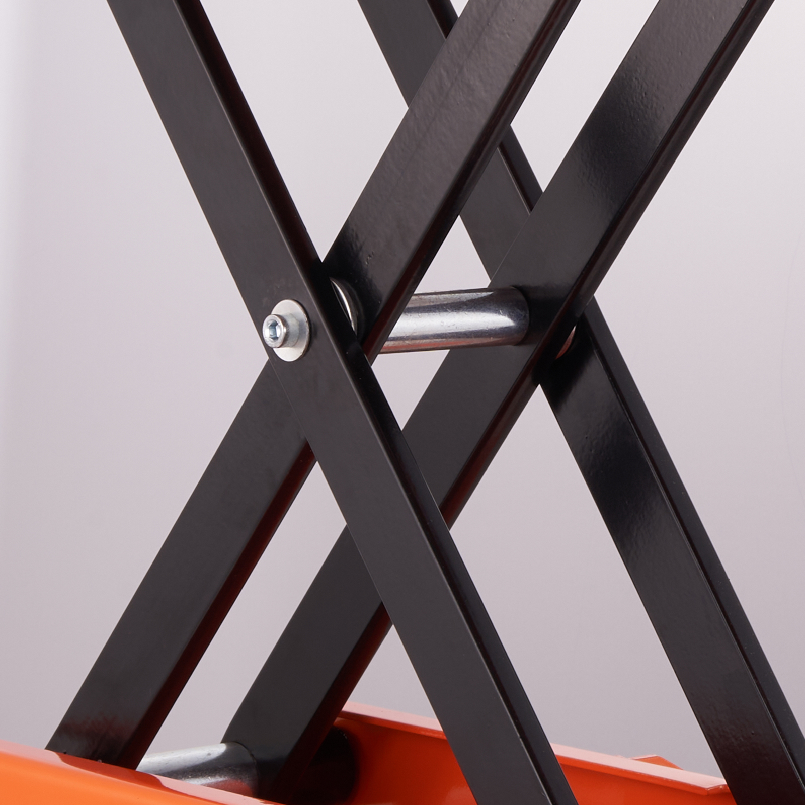 black steel frame and bolts of VEVOR motorcycle lift in use, showcasing sturdy construction.