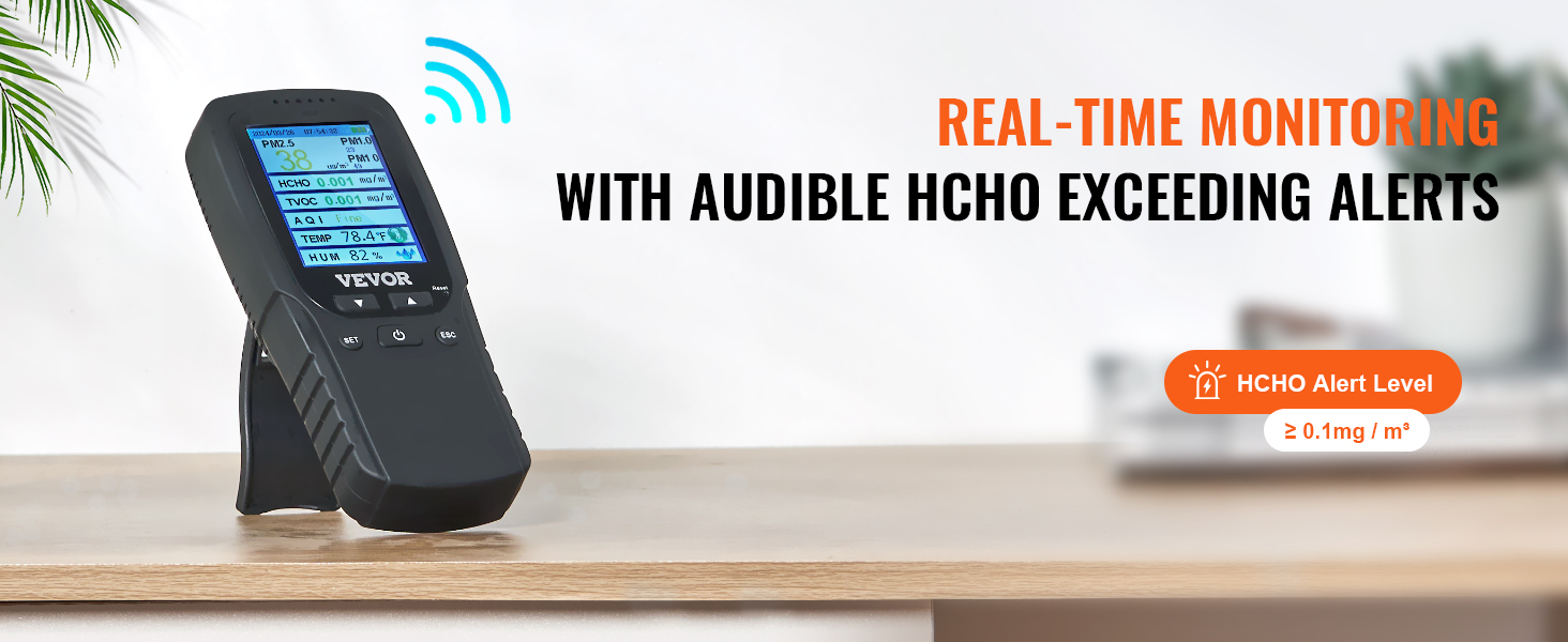 VEVOR air quality monitor displaying various readings with hcho alert notification on a desk.
