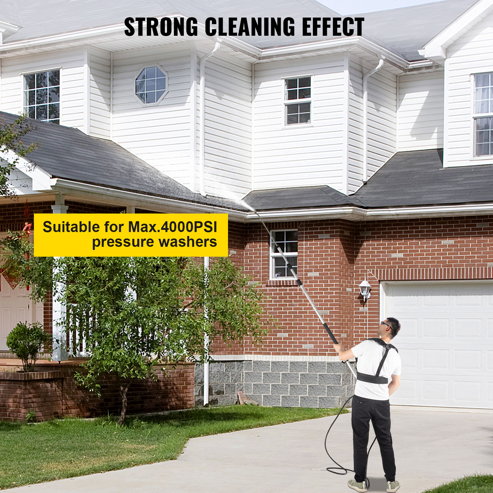 man using VEVOR telescoping pressure washer wand to clean a two-story house.