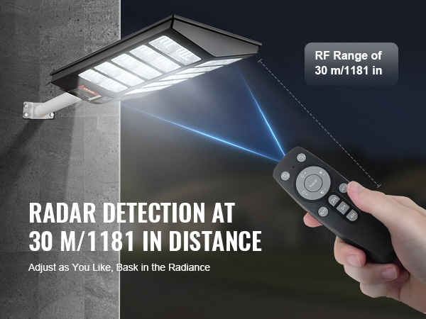 VEVOR solar street light with radar detection at 30 meters, operated by a handheld remote control.