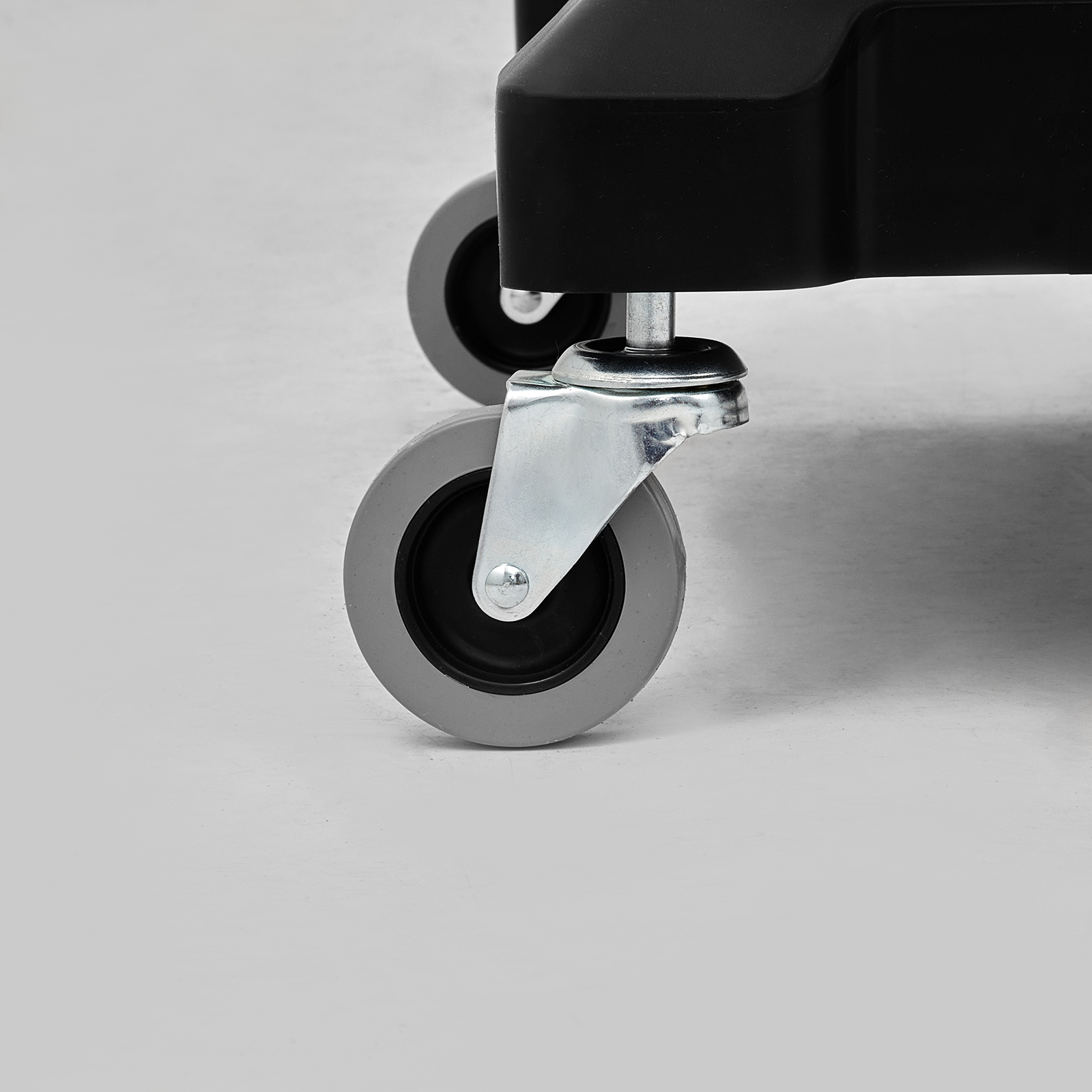 close-up of sturdy wheels on a VEVOR janitorial cart for smooth mobility on various surfaces.