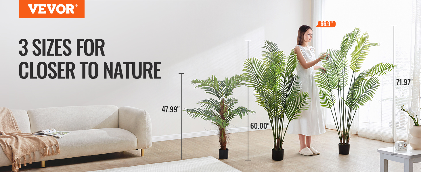 3 sizes of VEVOR artificial palm tree displayed beside a couch in a bright, modern room.