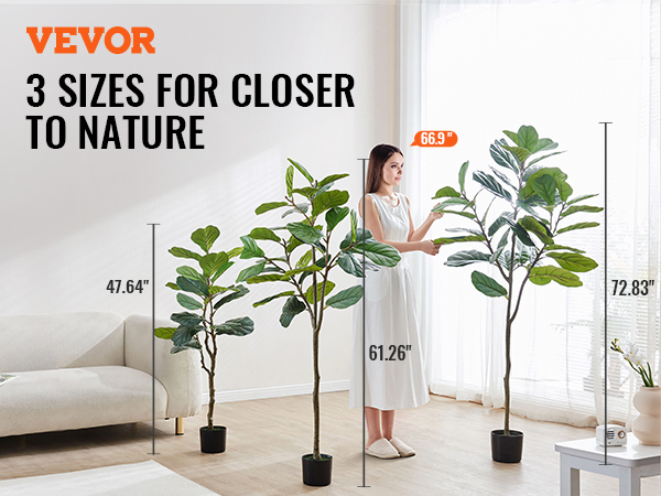 VEVOR artificial fiddle leaf fig tree in 3 sizes with a sofa and a person adjusting the tallest tree.