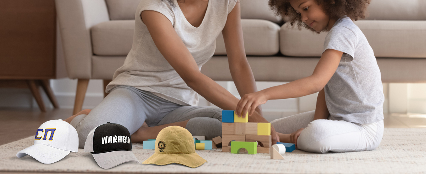 mother and child playing with blocks on carpet, featuring three custom hats made with the VEVOR hat heat press.