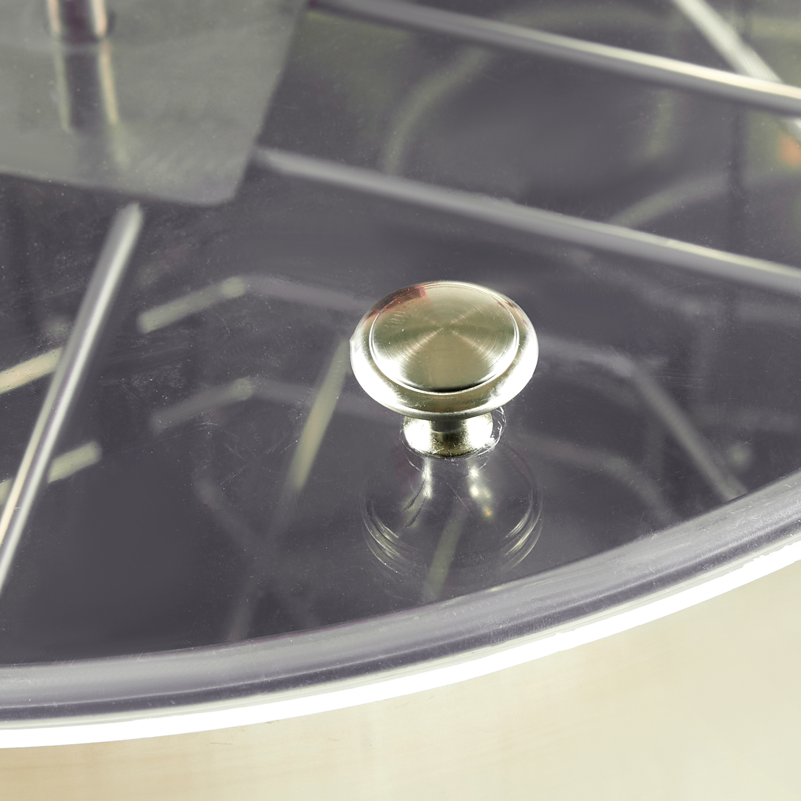 metallic knob and wireframe structure of a VEVOR honey extractor with clear view of its interior.
