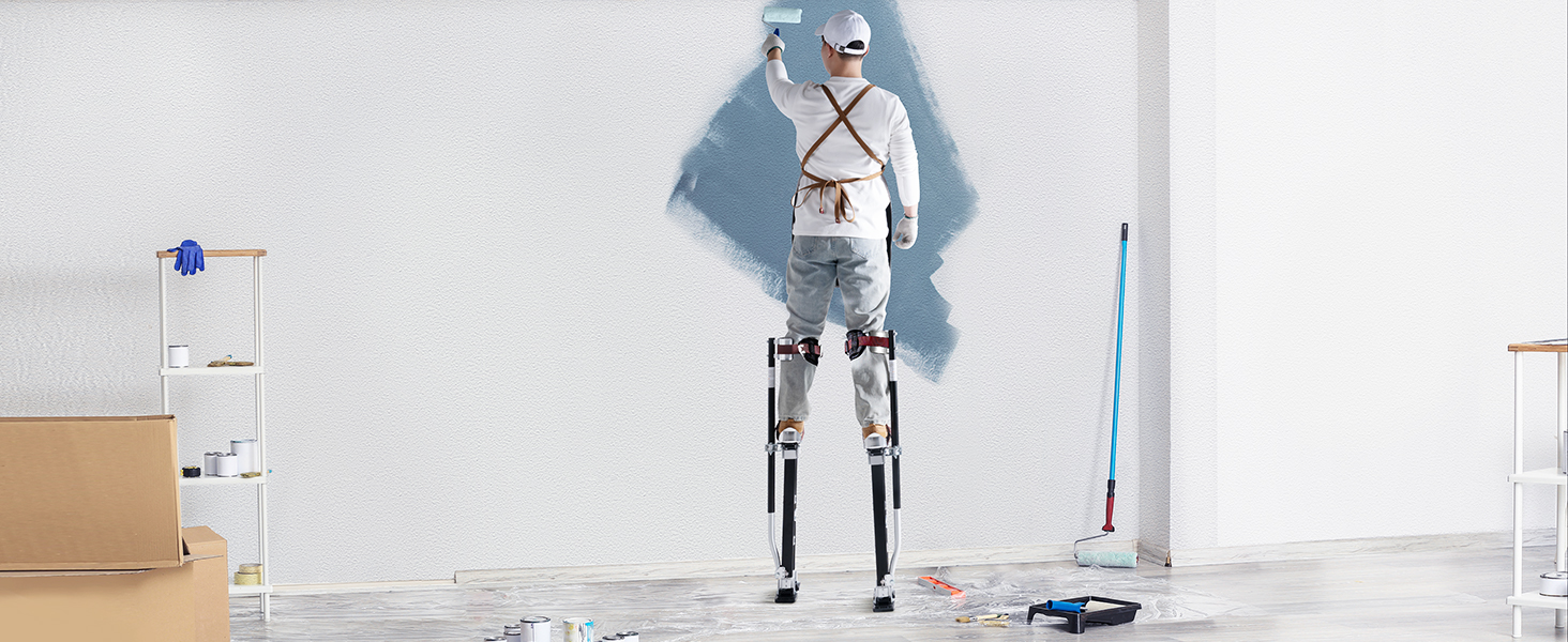 маляр, использующий сваи из гипсокартона VEVOR для покраски стены в окружении малярных инструментов и расходных материалов.