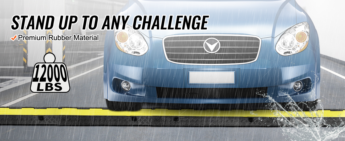 blue car crossing VEVOR cable protector ramp in rainy weather with