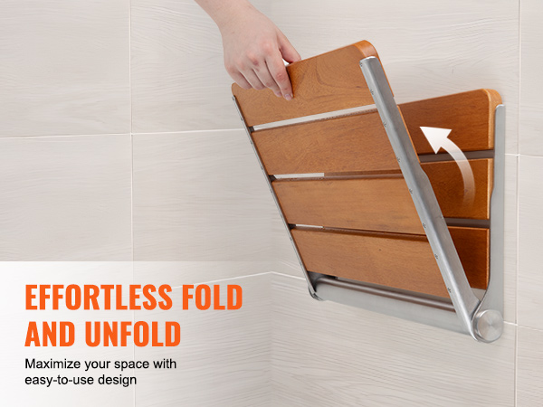 VEVOR folding teak shower seat mounted on wall with a hand folding the wooden slats, space-saving design.