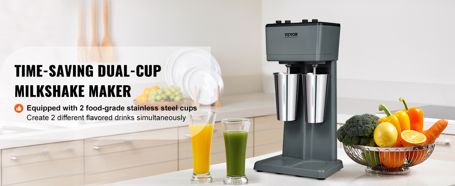 VEVOR milkshake maker in a modern kitchen with two stainless steel cups and fresh vegetables nearby.
