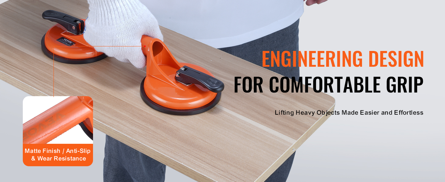 VEVOR glass suction cup lifting a wooden panel with anti-slip, wear-resistant matte finish for a comfortable grip.