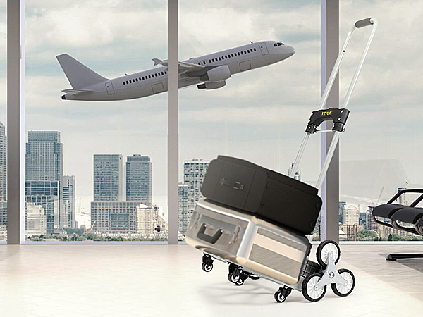 VEVOR stair climbing cart in airport terminal with seats and airplane taking off outside windows.