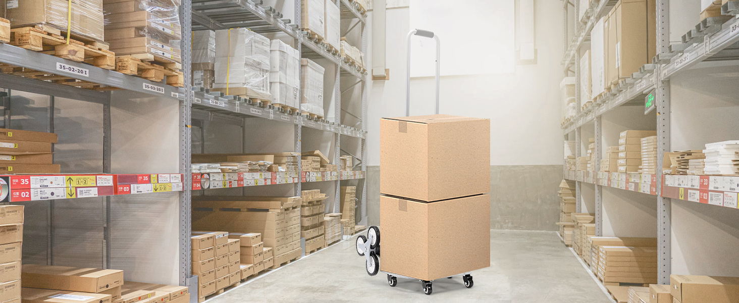VEVOR stair climbing cart transporting cardboard boxes in a well-organized warehouse aisle.