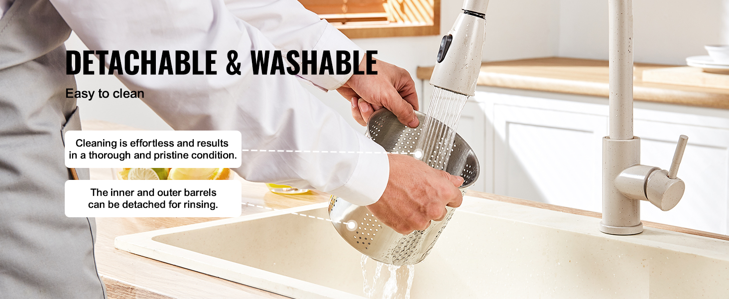 detachable and washable VEVOR fruit wine press being cleaned under a faucet in a kitchen sink.