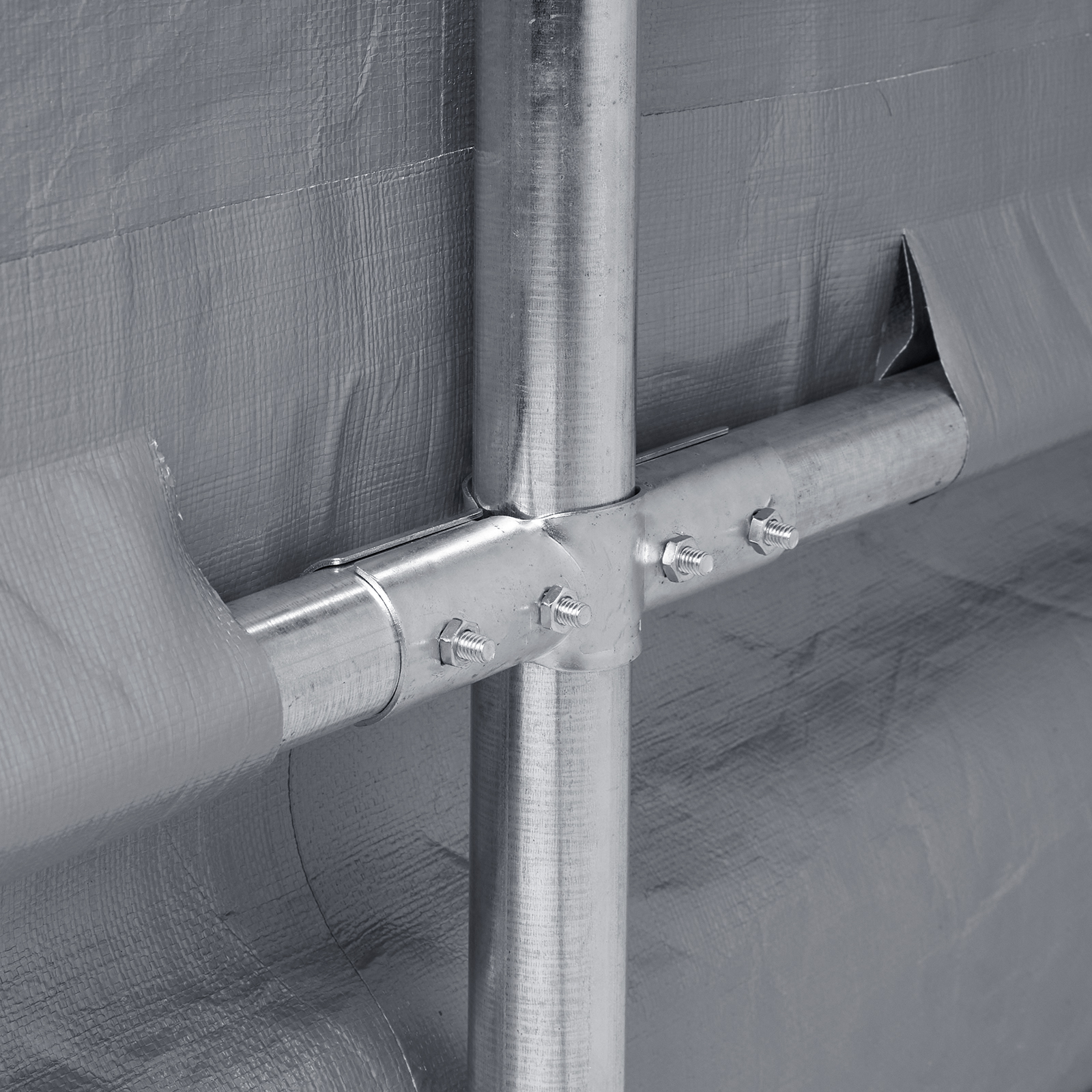 metal frame connection of VEVOR portable shed with gray fabric cover.