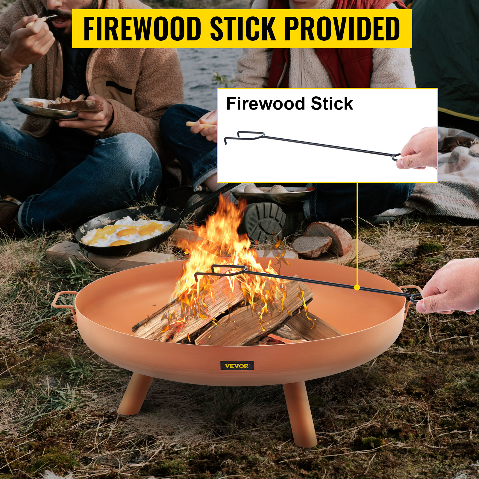VEVOR fire pit bowl with firewood stick, surrounded by people eating outdoors.