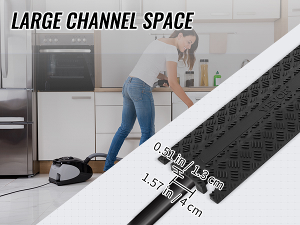VEVOR speed bump with large channel space, dimensions shown, kitchen background with vacuum.