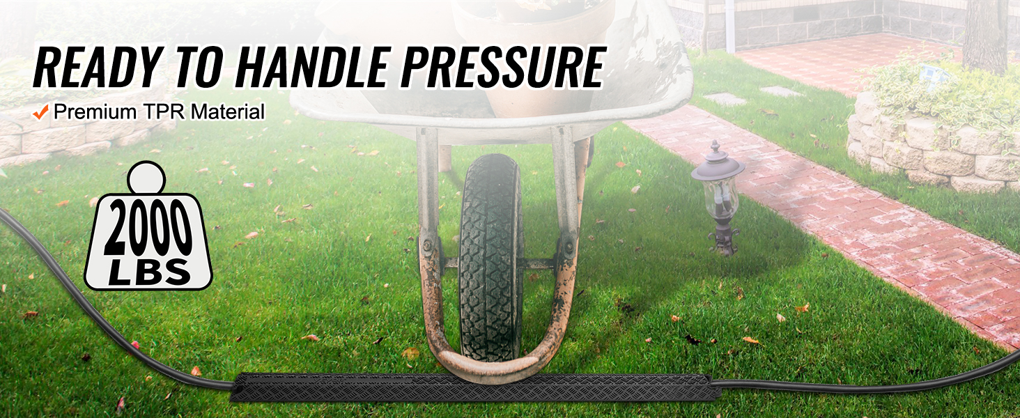 wheelbarrow on VEVOR speed bump, handling 2000 lbs, made of premium tpr material in a garden setting.